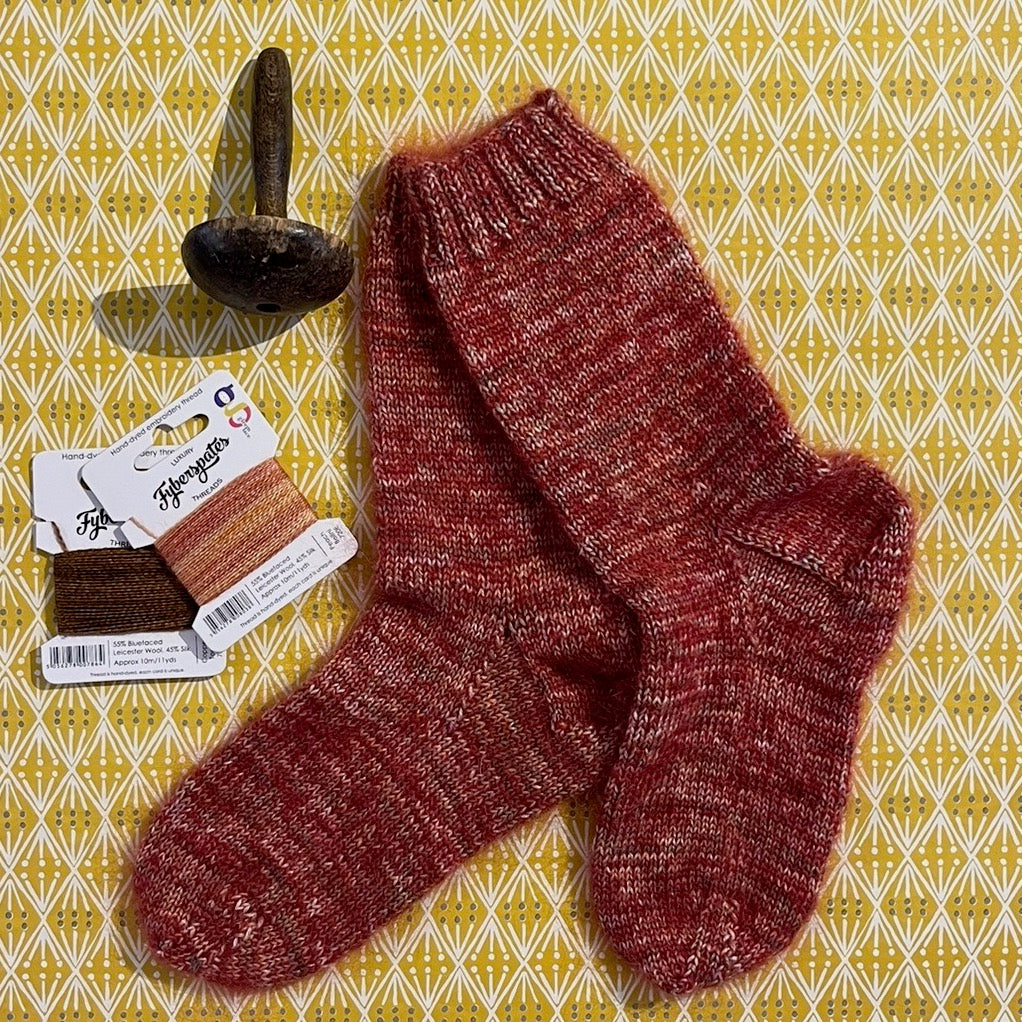 Variegated ruby hand-knitted socks | Seam Haberdashery