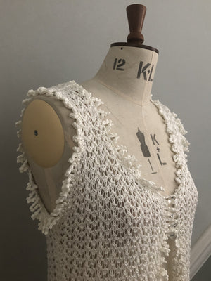 Lace-knit sleeveless cardigan